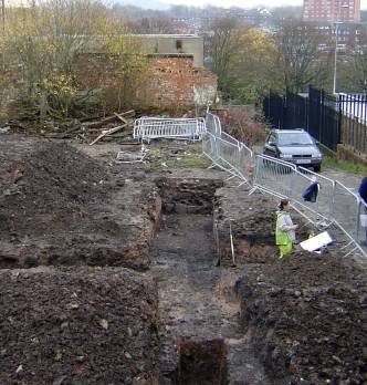 Trenches across the mound, where the River Douglas once ran