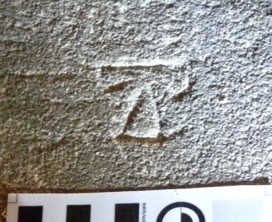 Enclosed T-shape (stylised). Three examples