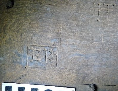Engraved letters ‘E R’ – boxed with serifs