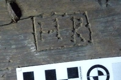 Crudely engraved letters ‘H R’